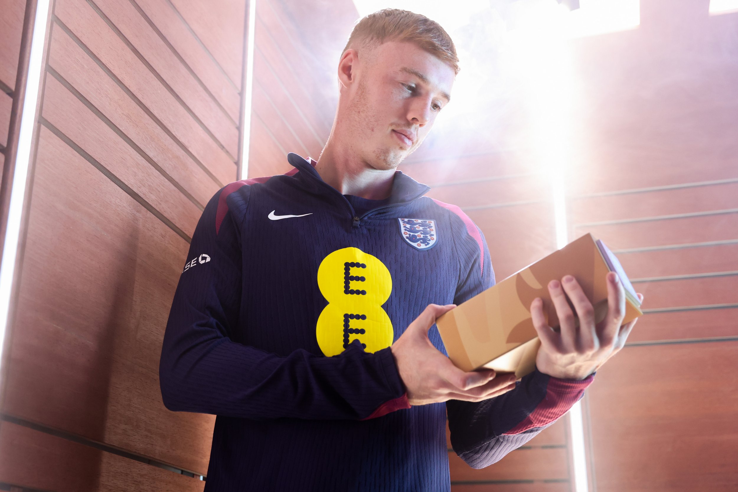 Cole Palmer of England poses for a photo with the award for England Senior Men's Player of the Year at St Georges Park