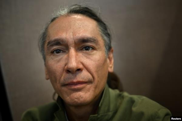 Kim Aris, the son of Myanmar’s detained former leader Aung San Suu Kyi, poses for a portrait at the Reuters office in London, Aug. 2, 2023.