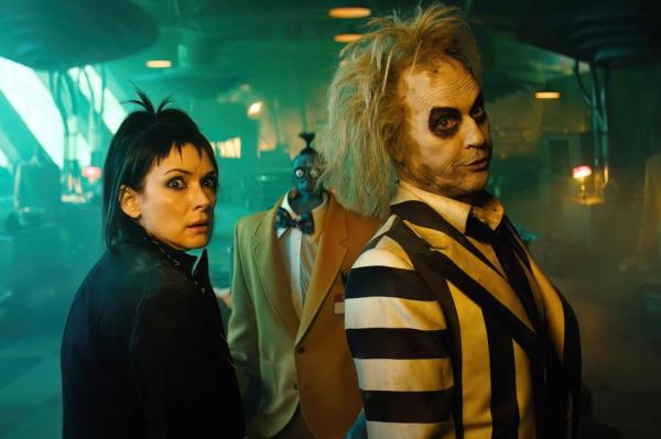 Winona Ryder and Michael Keaton in a scene "Beetlejuice Beetlejuice."